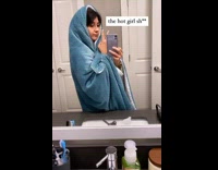 Girl wraps blue blanket around herself mirror 