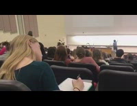 Guy loses python snake inside lecture hall classroom and looks for it during lesson