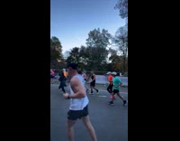Guy toss beer to man on marathon