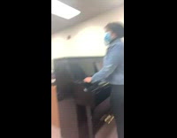 Two people do squidward impressions in computer lab
