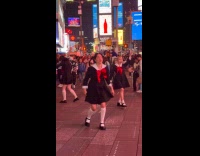 Girl dance group black sailor uniform times square