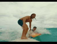 Collab Kook Of The Day - Guy riding surfboard pushes other surfer away 