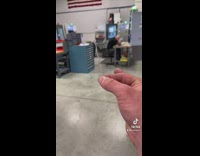 Guy picks up little piece of metal trash from trash can wand