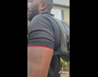 Man Lifts Four Cases of Water Bottles