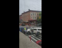 Altercation at intersection where people arguing outside vehicles