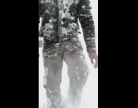 Guy falls back makes snow angel park 