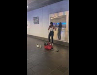 Woman sings and twerks at station 