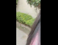 College woman jumping up and down after surprise family visit