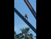 man bun steel beam art display beach