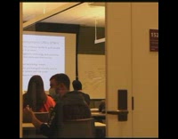 Guy offers classmate drink in class 