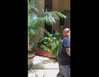 Woman in floral dress tiktok dance at the mall