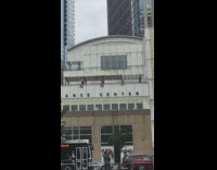 Dance company performance has dancers on roof 