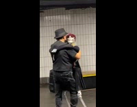 Guy dances bachata with skeleton 