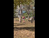 Woman pink sports bra hold coconut park