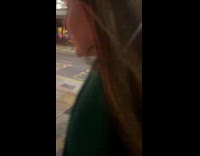 Woman upset walks on street throws chips.