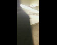 Rat costume guy crouches on trash can 