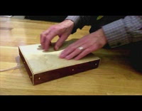 Man scratch wooden pad produce sound effects