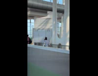 Collab IITW - Woman dances with drumsticks on the building