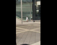 Woman white long sleeves pose beside escalator
