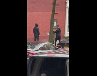 Friend throws water on guy waterproof jacket 