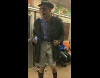 Man black fur coat blue red plaid shirt talks about church and religion in subway train