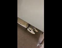 Guy harasses guy with Nike shoes on toilet