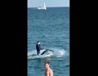 Man in Michael Myers rides jet ski