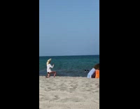 Yellow hat denim overall shorts girl beach 