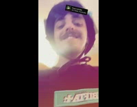 Man Shows Helmet with OCB Packets on it