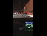 Guy rides bicycle freeway bridge underpass night 