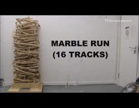 Marbles metal balls go down wood tower 