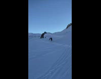 Skier jumps over pile of snow falls and flips 