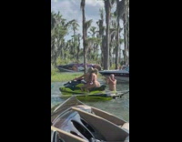 Two girls bikini ride jet ski lake