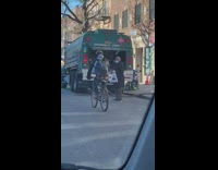 Guy rides bicycle with butt showing pants