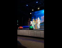 Girl greets shepherds on stage play musical