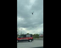Helicopter carry guy hang on rope bbq