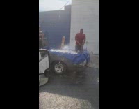 Collab WINY - Man swims at back of pick up truck 