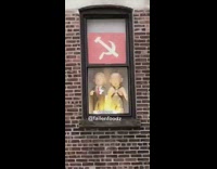 trump putin dolls on window of building
