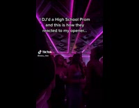 Disc Jockey Works Up Crowd and Cheers