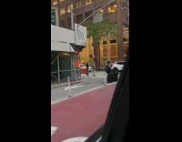 Collab WINY - A man on the crosswalk is holding a car door