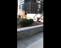 Girl red boots stone planter black dress