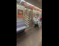 Spiderman and pink wig woman in subway