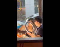 Couple with camera and light in restaurant