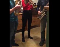 Dog bark talks while people play instruments