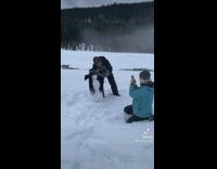 Parents Take Picture with Snowman on Ladys Wig