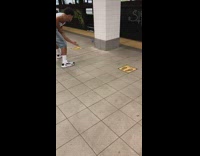 Guy bounces blue ball subway train station 