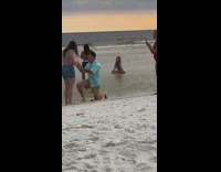 Man proposes to girlfriend while a photoshoot is behind them