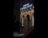 Couple making out outside funeral homes 