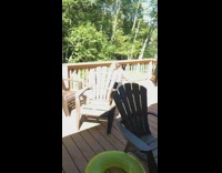 Black bikini top girl balcony lake water