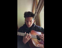 Collab BitchIG2 - Guy playing mash up on brown guitar